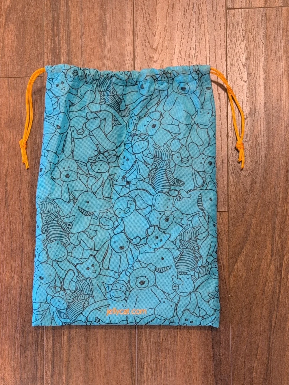 Jellycat Teal Toy Print Drawstring Bag with Orange Cord
